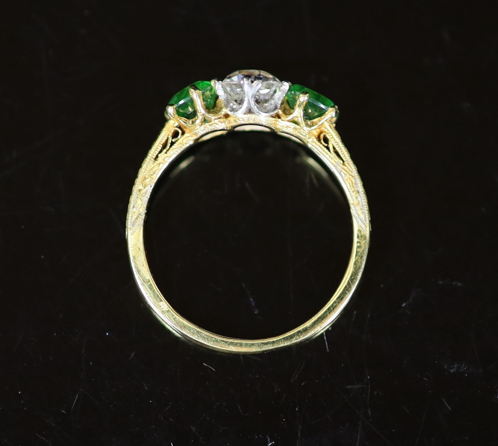 A Tiffany & Co gold, single stone diamond and two stone demantoid garnet set ring